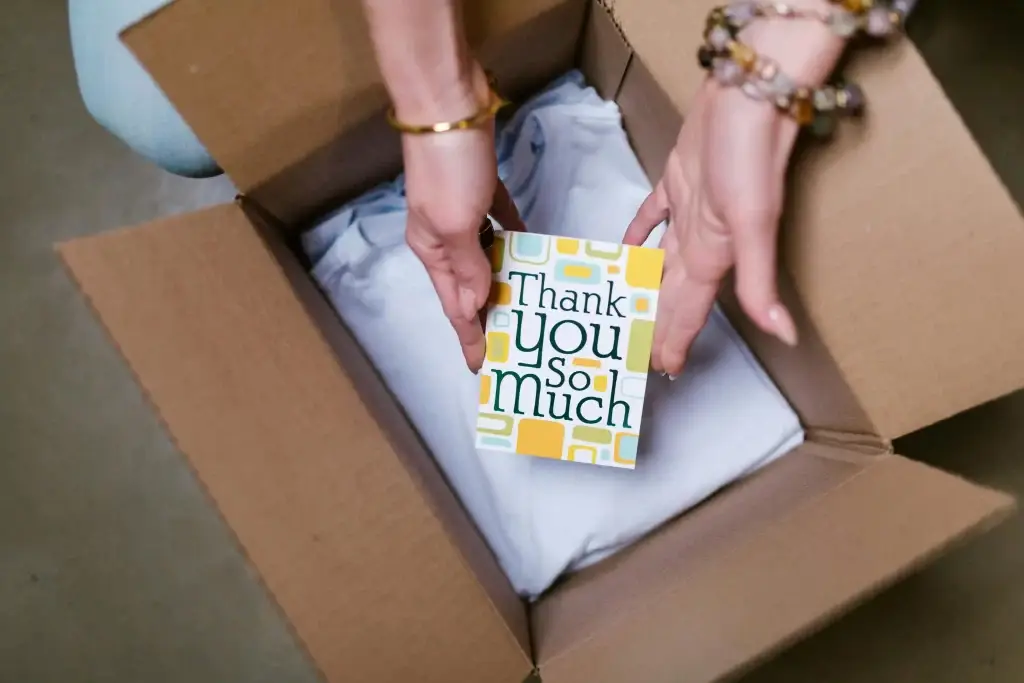 Hack. How To Stop Chasing Algorithms An E-commerce Marketing Masterclass 1 a box of tshirts with a thank you note someone doing ecommerce marketing
